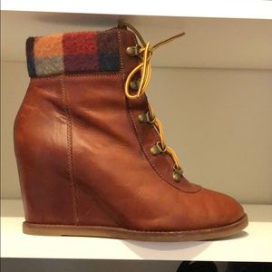 Soft leather brown lace up wedge booties.